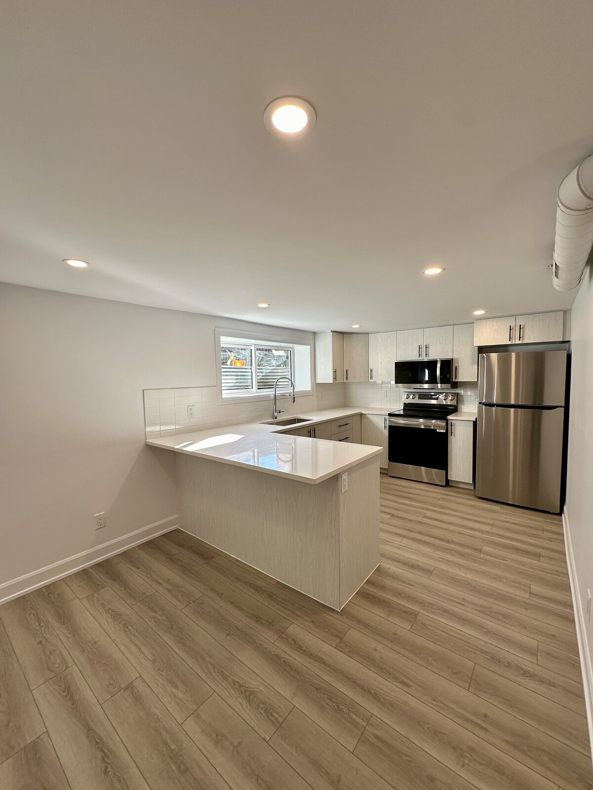 Basement secondary dwelling unit kitchen by WAIDT